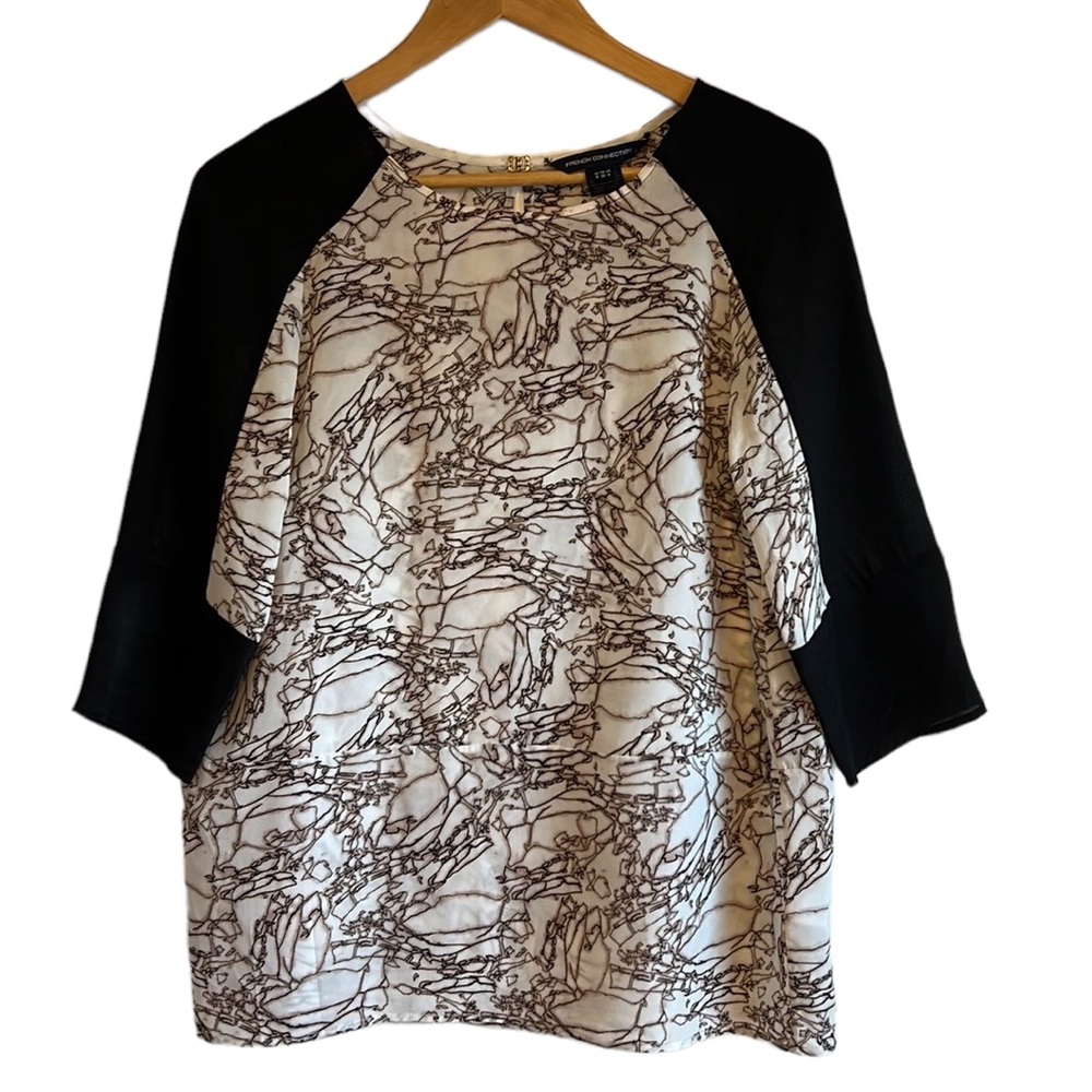 French Connection 100% silk blouse. 3/4 sleeve scoop neck size 8 Like new.